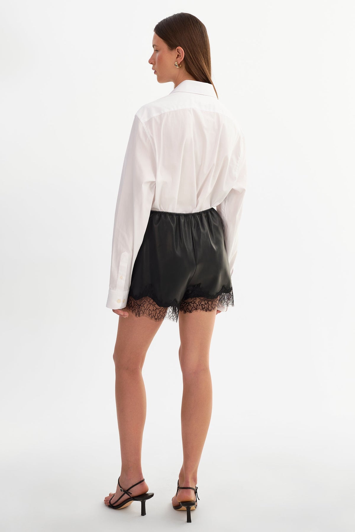 FARAH lace trim faux leather shorts in black — styled view