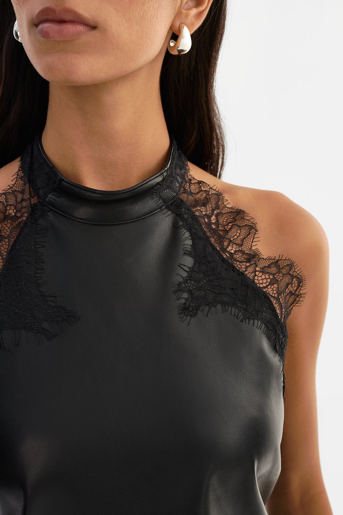 GINNY lace trim faux leather halter top in black — open back
